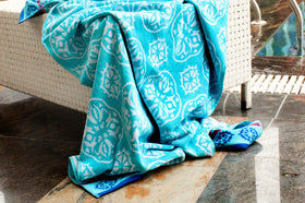 Cotton Craft Summer Trellis pattern towel in vibrant pool blue hues.