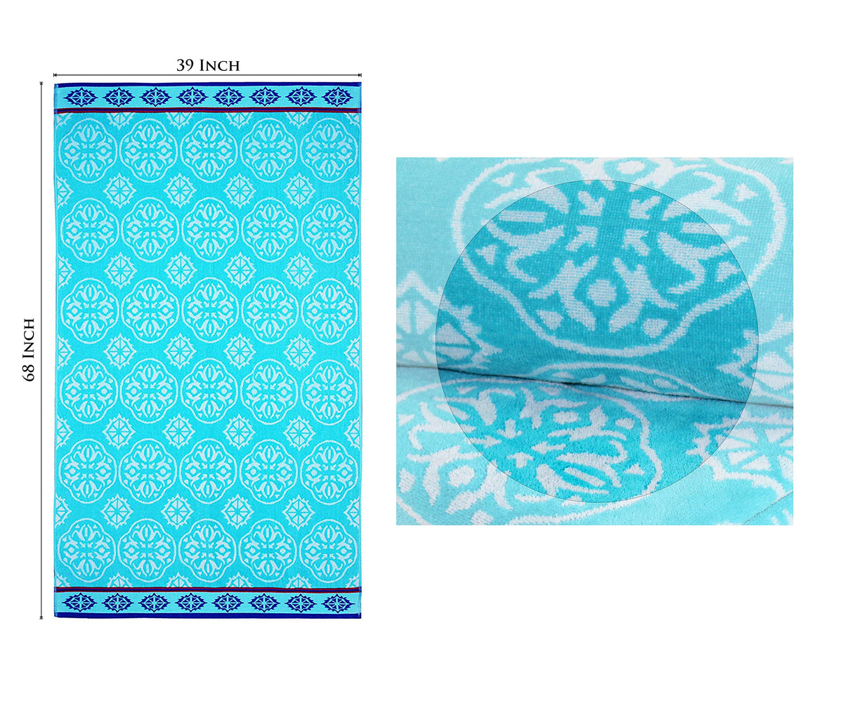 Cotton Craft towel on a lounge chair by water for sun-soaked relaxation.