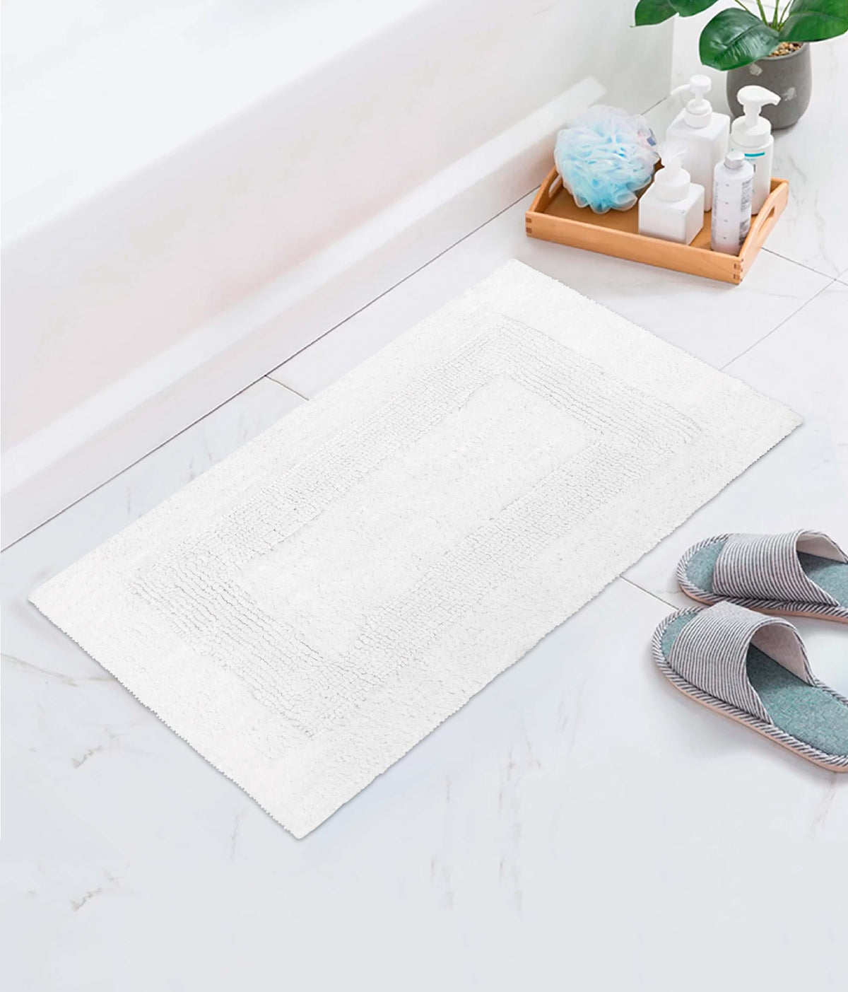 Cotton Craft 2-piece bath mat set, home-friendly white color and soft feel.