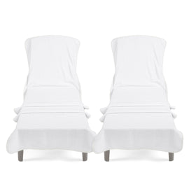 Cotton Paradise lounge towel with pocket on white fabric stays secure on pool chairs.