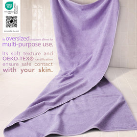 Cotton Paradise oversized towel in lilac on a rack