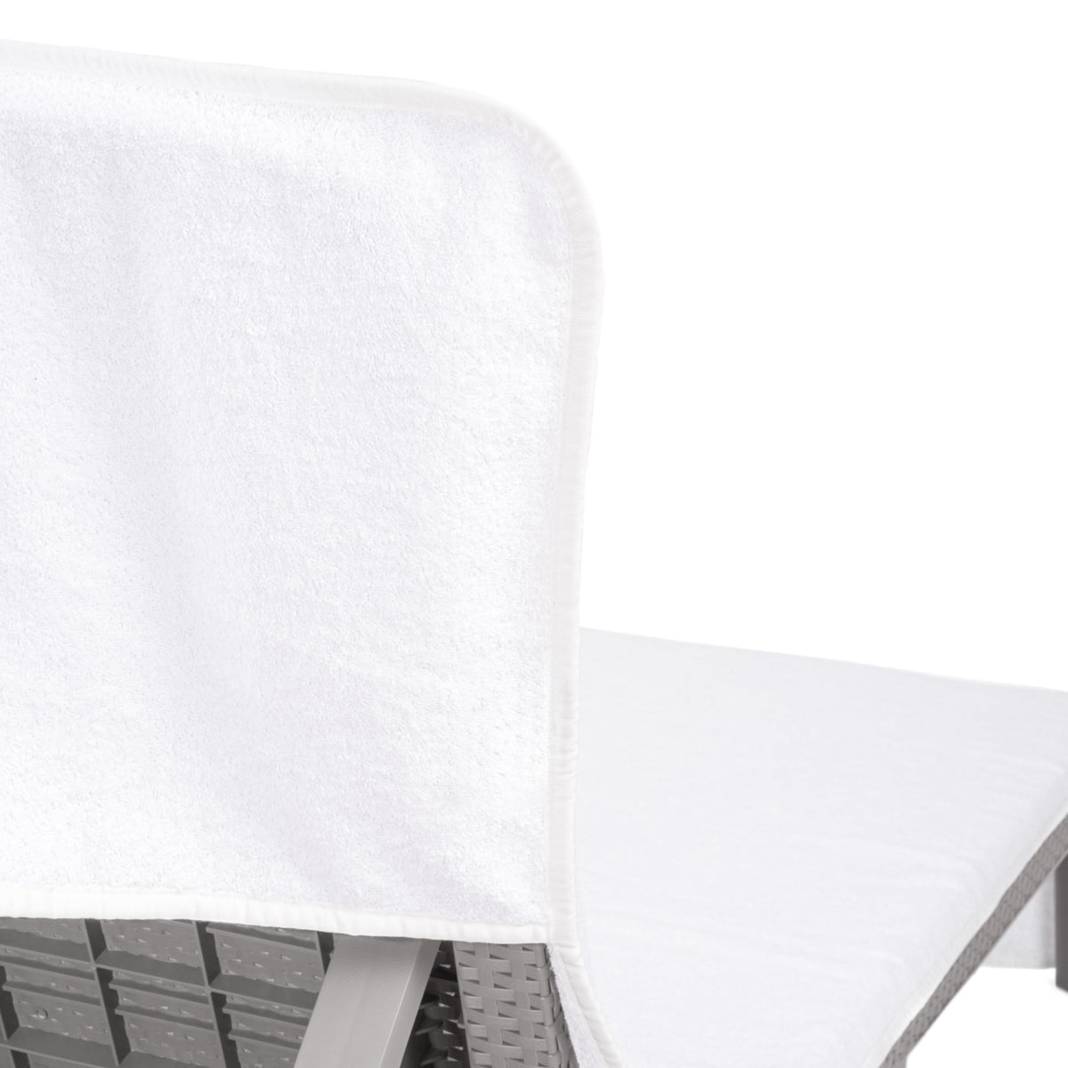 Cotton Paradise towel with 8-inch pocket keeps belongings secure during lounging.