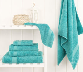 Cotton Paradise turquoise hand towels showing high absorbency for daily use.
