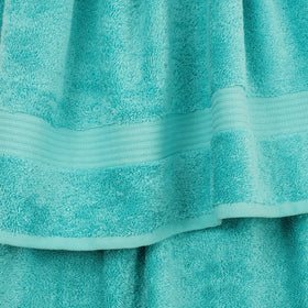 Cotton Paradise turquoise washcloths providing gentle cleansing with spa-like softness.