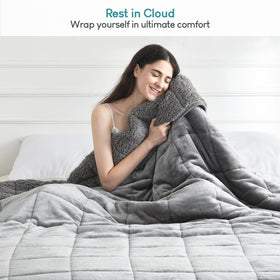 Cottonblue easy-care fade-resistant blanket in gray under a light wash.