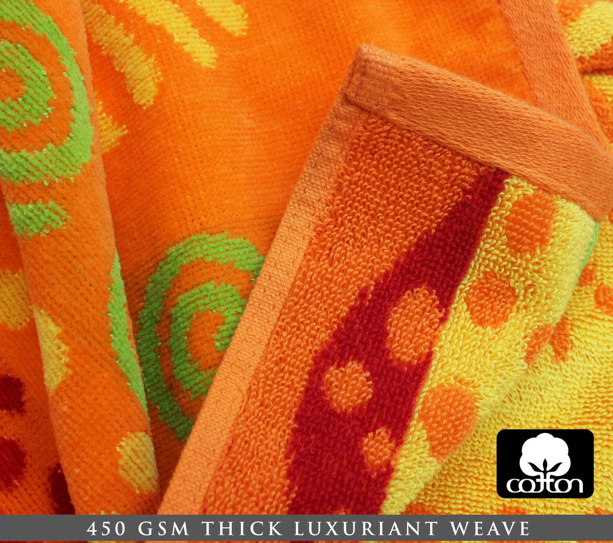Cotton Craft velour finish beach towel in sun colors; luxurious feel for lounging.