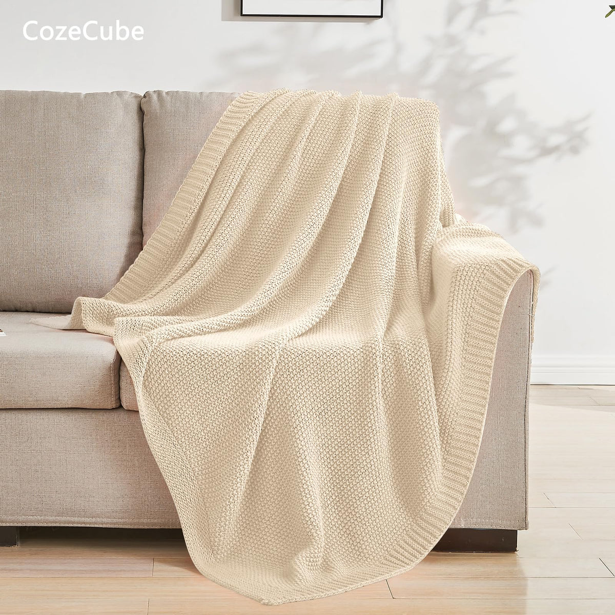CozeCube beige throw on bed creates inviting decor and easy warmth