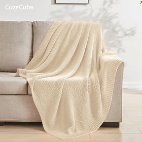 CozeCube beige throw on bed creates inviting decor and easy warmth