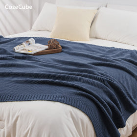 CozeCube blue throw on a chair enhances cozy farmhouse style.