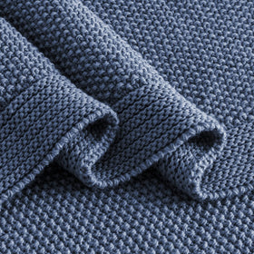 CozeCube blue knit throw shown as a perfect cuddle companion.