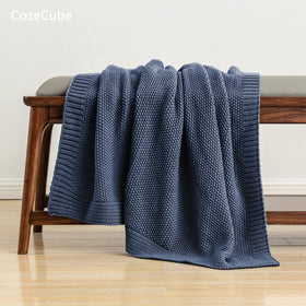 CozeCube blue throw close-up shows wrinkle-resistant and colorfast yarn.