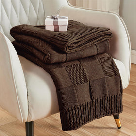 CozeCube check-knit throw dark brown on couch, providing cozy warmth for chilly evenings