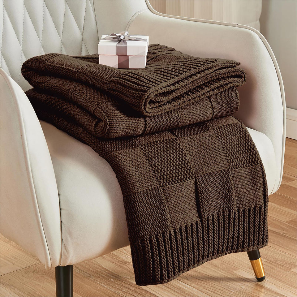 CozeCube check-knit throw dark brown on couch, providing cozy warmth for chilly evenings
