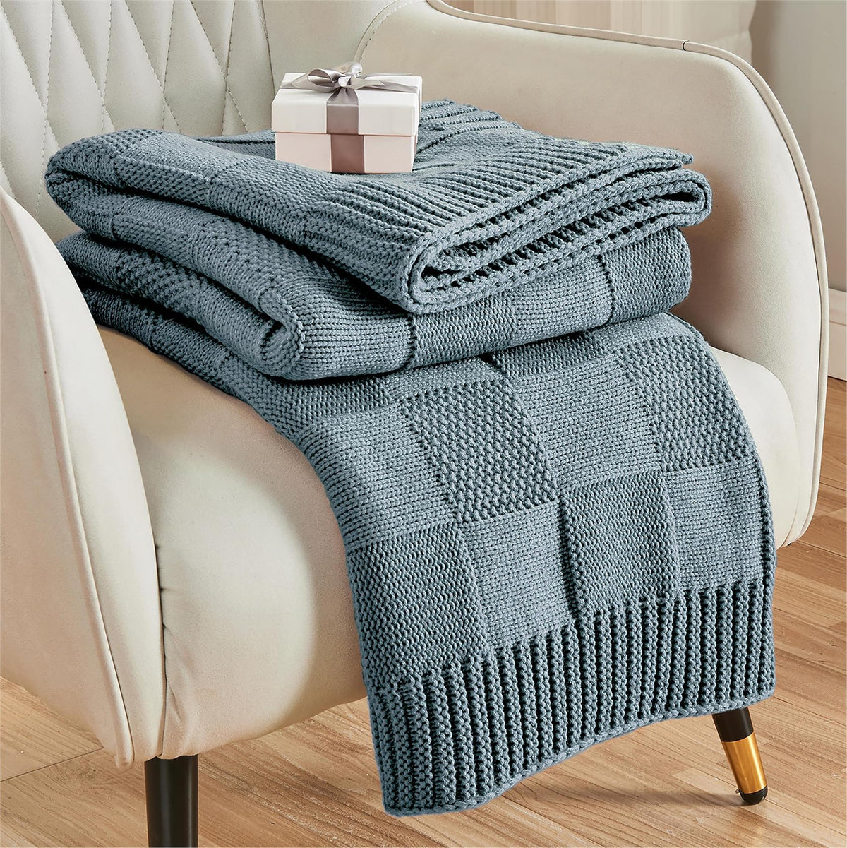 CozeCube dusty blue check knit throw adds warmth and style to the couch.