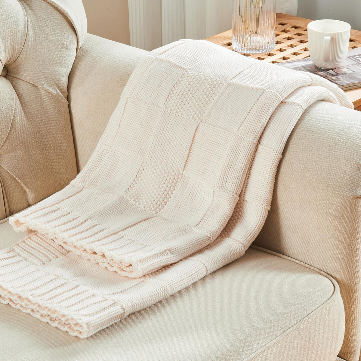 CozeCube Check Knit Throw wrapped around chair for inviting warmth