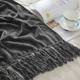 CozeCube blanket in gift-ready packaging suggests a thoughtful housewarming.