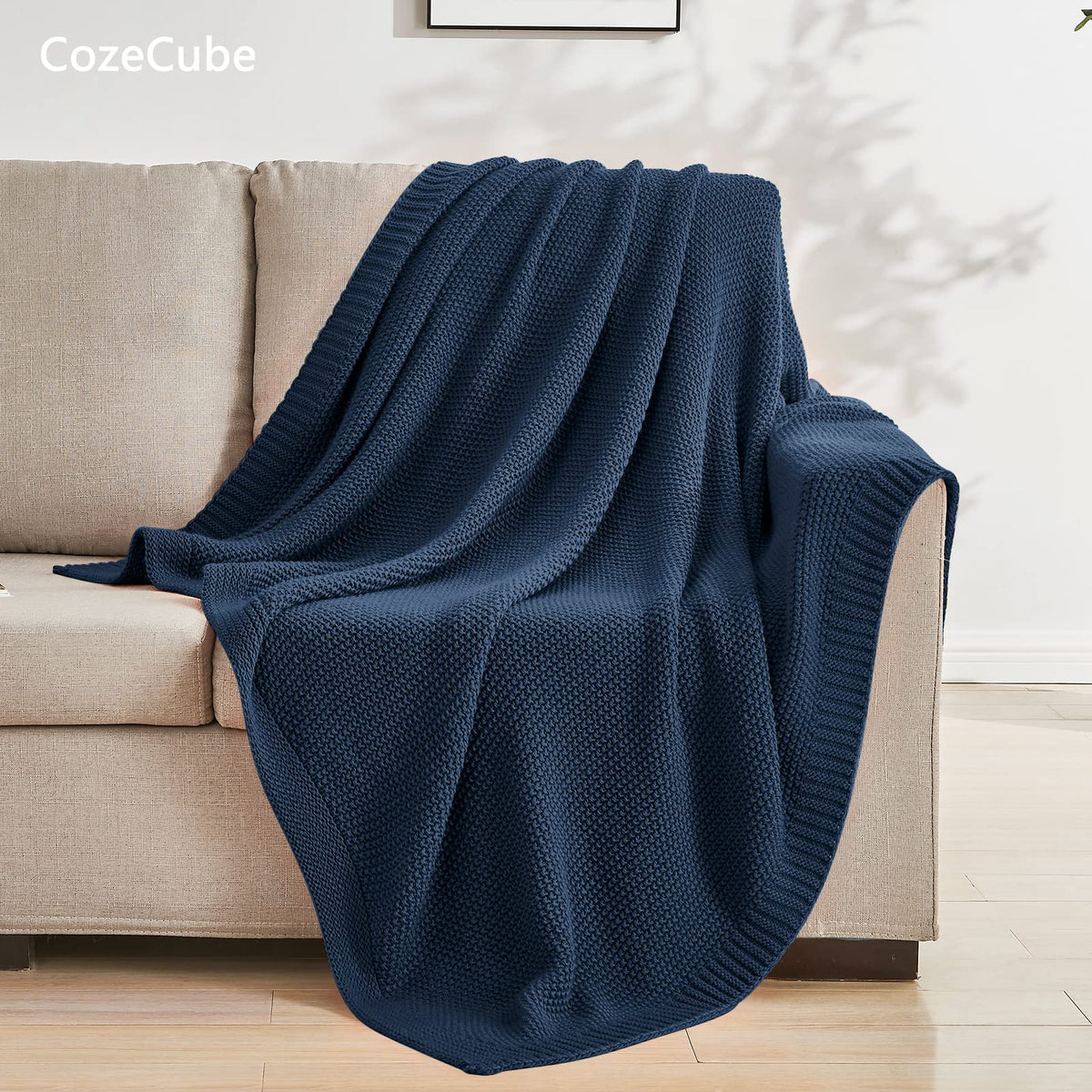 CozeCube navy blue knit closeup highlights breathable acrylic yarn for year-round comfort.