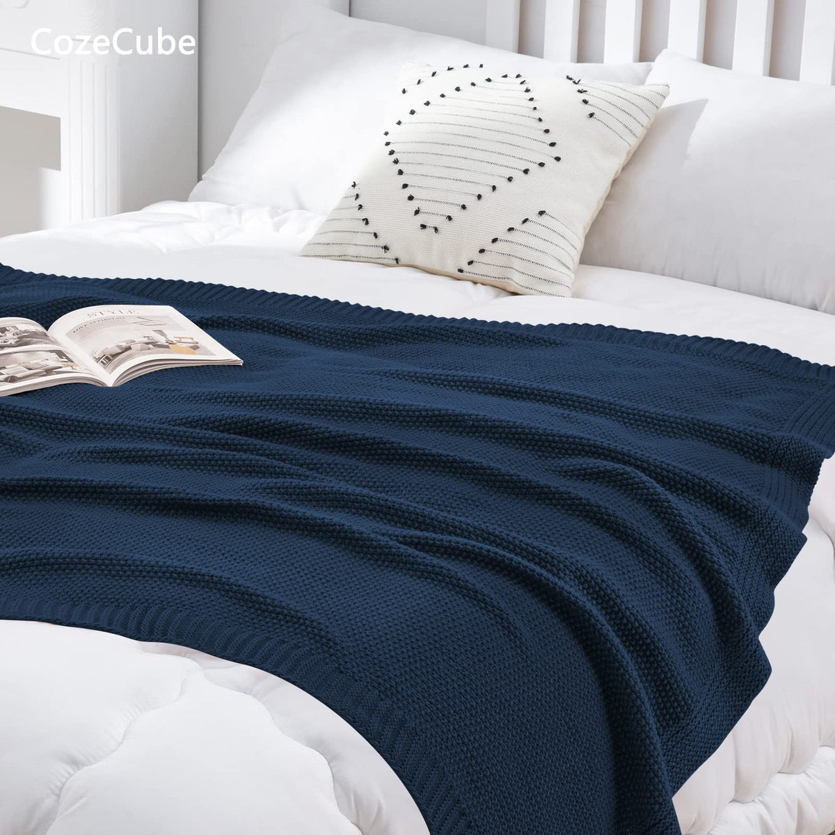 CozeCube navy blue lifestyle scene demonstrates versatile use on sofa, chair, or ottoman.