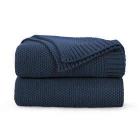 CozeCube navy blue throw on sofa adds soft warmth for chilly evenings.