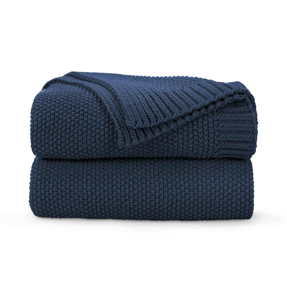 CozeCube navy blue throw on sofa adds soft warmth for chilly evenings.