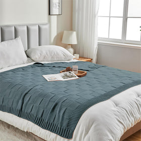 CozeCube seed-stitch check pattern blanket enhances rustic home style.