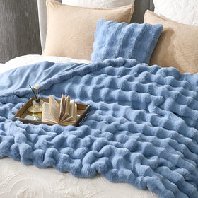 Folded Cozy Bliss Bubble Throw showing soft interior