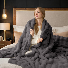 Gift-ready presentation invites warmth from Cozy Bliss Bubble Throw.