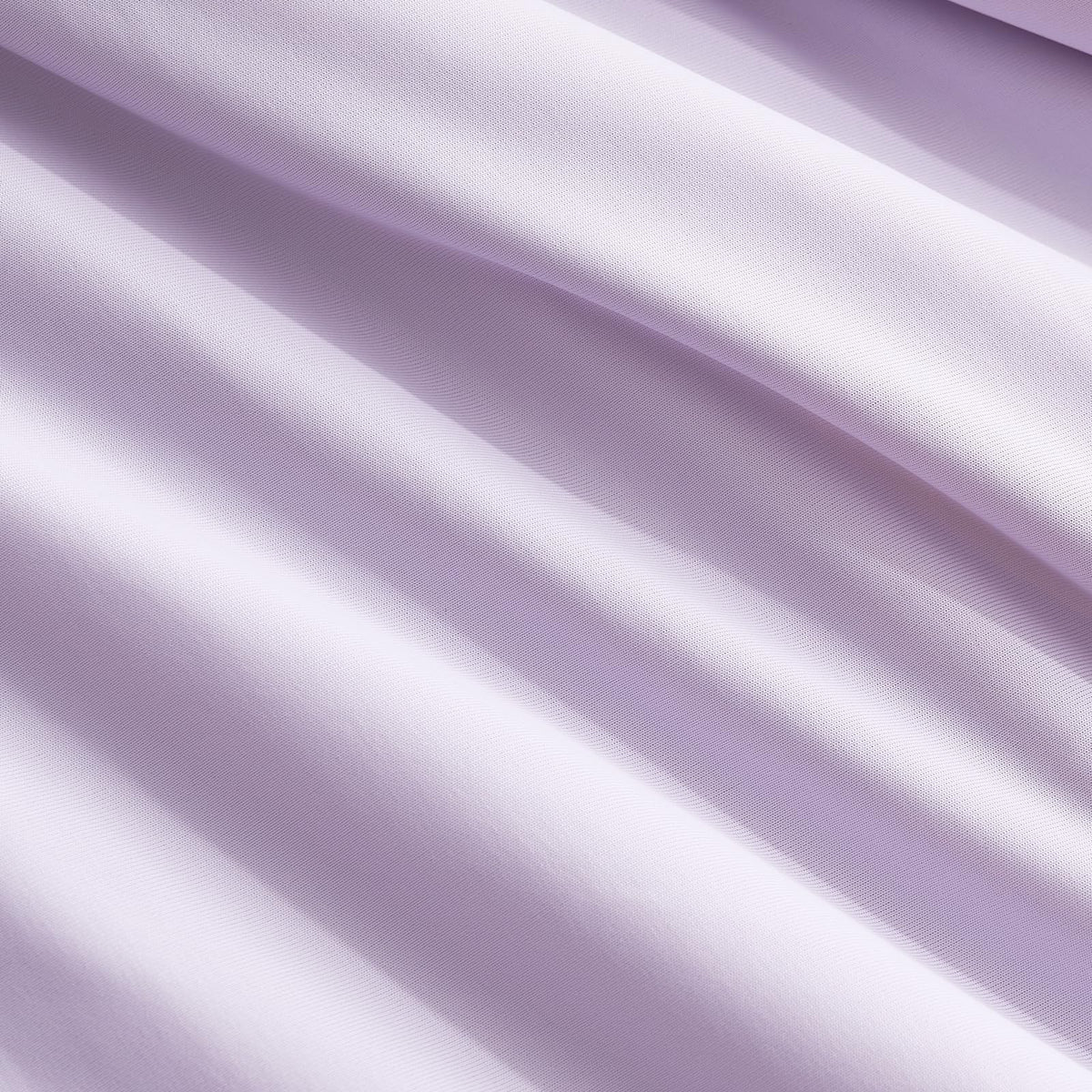 Cozy Bliss Cooling Comforter in use for reading or relaxing.