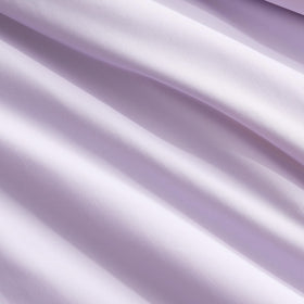 Cozy Bliss Cooling Comforter in use for reading or relaxing.
