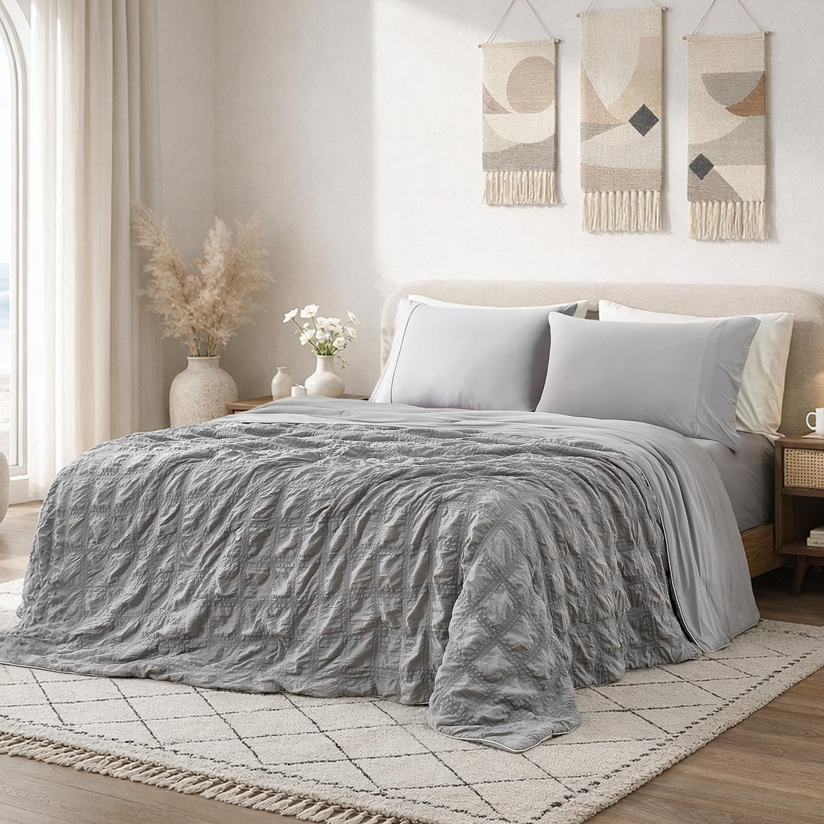 Cozy Bliss cooling comforter on king bed with seersucker plaid for refreshing nights.