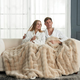 Cozy Bliss faux fur throw beige on sofa showcases plush warmth.