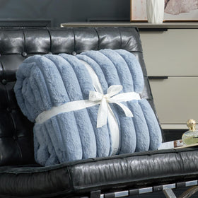 Cozy Bliss faux fur throw on bed enhances cozy bedroom ambiance