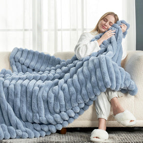 Close-up texture of Cozy Bliss faux fur blanket showing softness