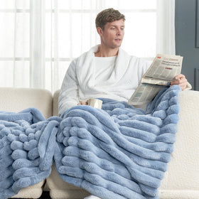 Cozy Bliss faux fur throw displayed as sofa decor