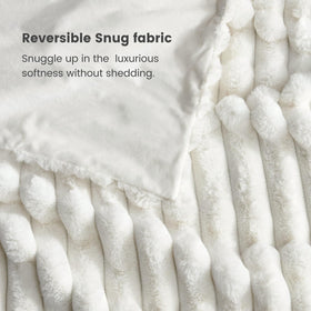 Striped detail on Cozy Bliss faux fur throw blanket enhances decor