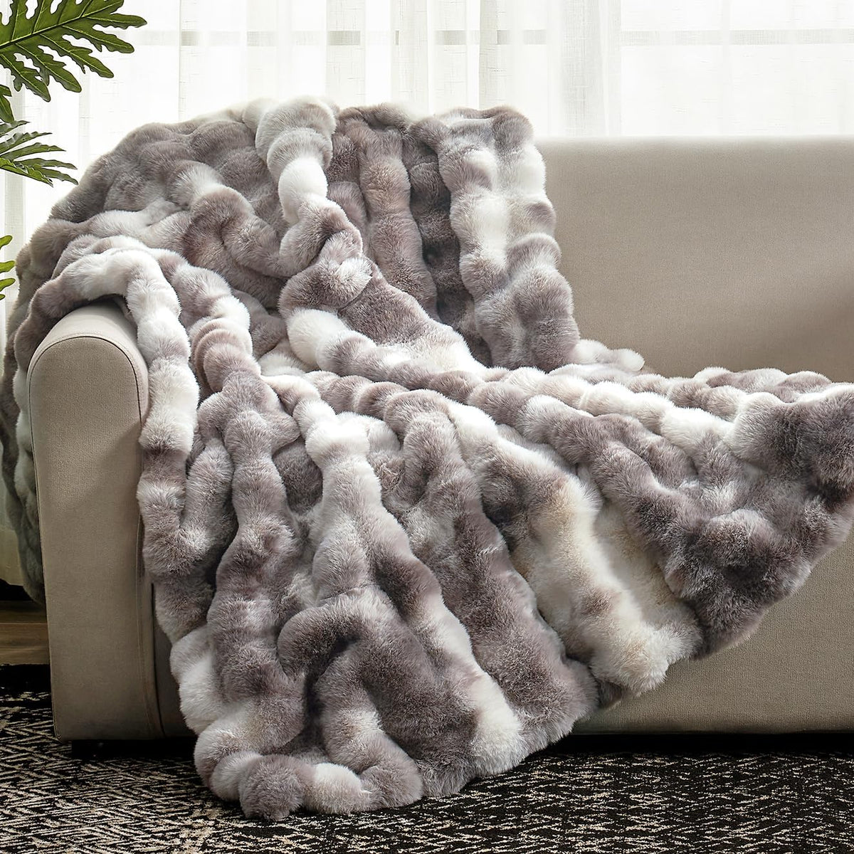 Cozy Bliss faux fur throw with bubble design adds cozy texture to any couch.