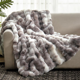 Cozy Bliss faux fur throw with bubble design adds cozy texture to any couch.