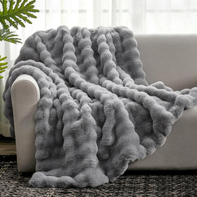 Cozy Bliss faux fur throw on sofa showing plush warmth for cozy evenings