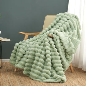 Cozy Bliss sage green faux fur throw on couch for inviting warmth