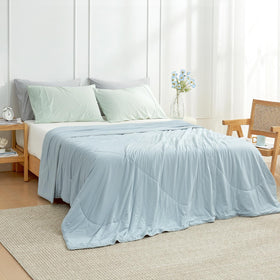 Cozy Bliss folded lightweight blanket emphasizes breathable summer feel.