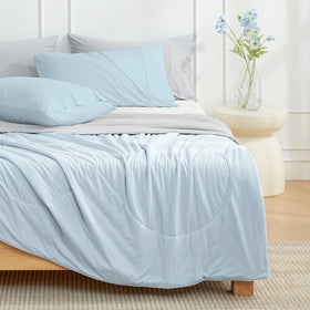 Cozy Bliss gift-ready comforter displayed in a cozy bedroom setting.