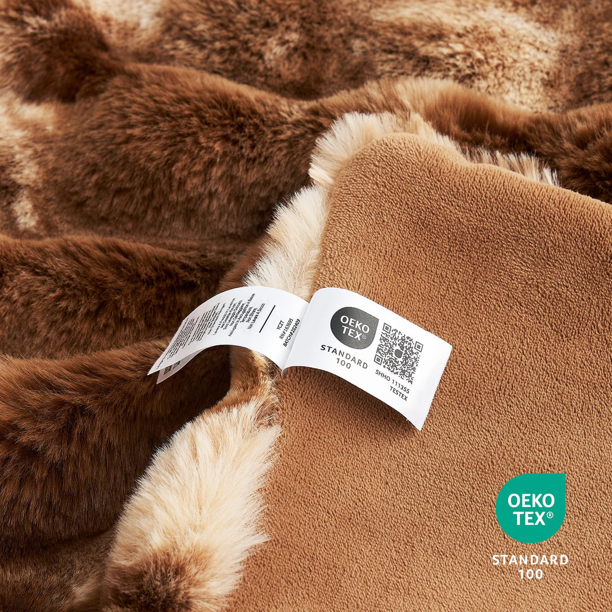 Cozy Bliss plush throw on living room chair creates inviting, warm lounging space.