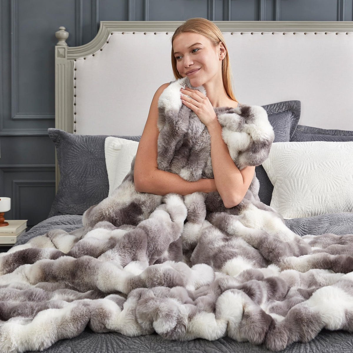 Cozy Bliss bubble-design throw complements decor and adds visual depth.