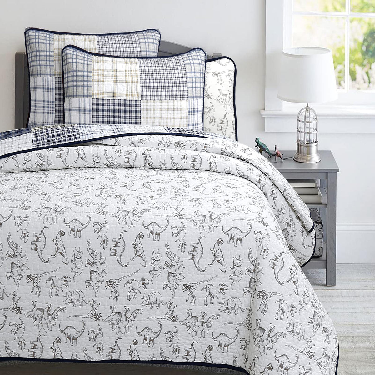 Benjamin dinosaur quilt is reversible for quick room updates and fresh looks.