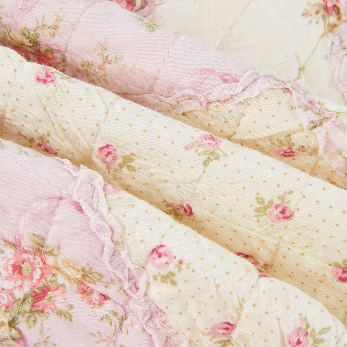 Cozyholy throw-size quilt draped over a couch for cozy lounging.