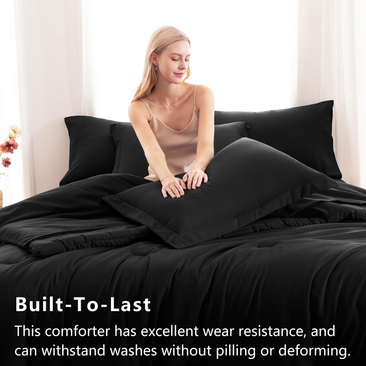 CozyLux black flat sheet detail highlights smooth finish and care-friendly fabric