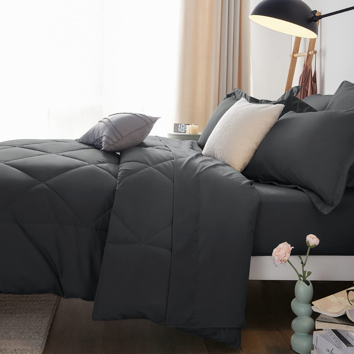 CozyLux cozy bedroom scene in soft lighting with dark grey bedding