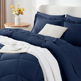CozyLux navy blue comforter set styled on bed demonstrating all season versatility