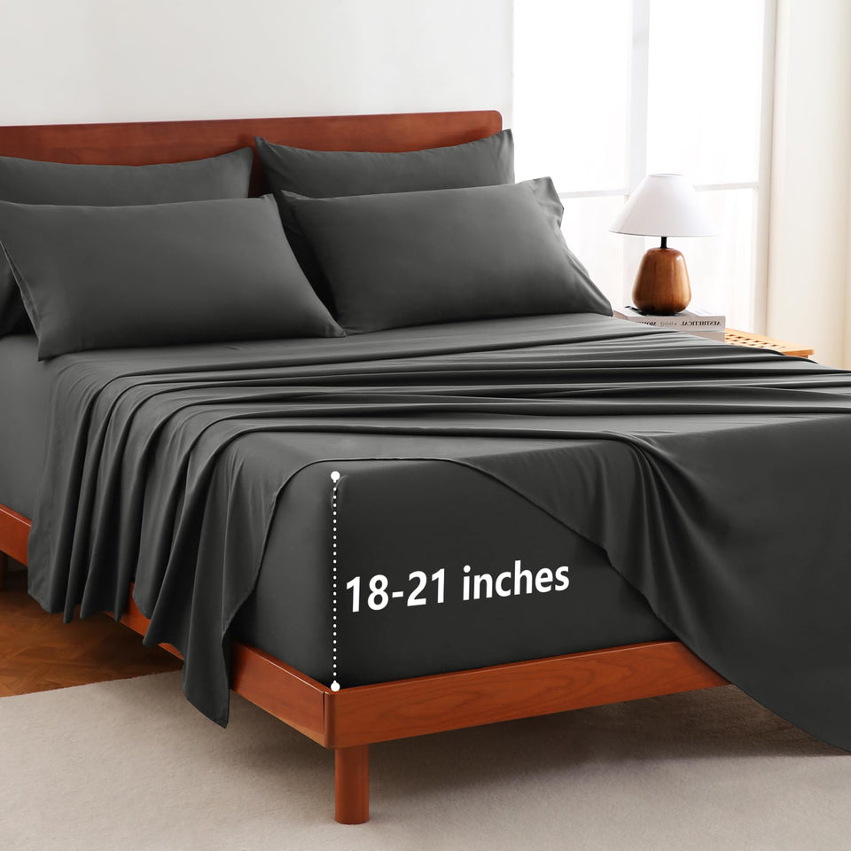 CozyLux extra-deep-pocket queen set on bed showing secure fit