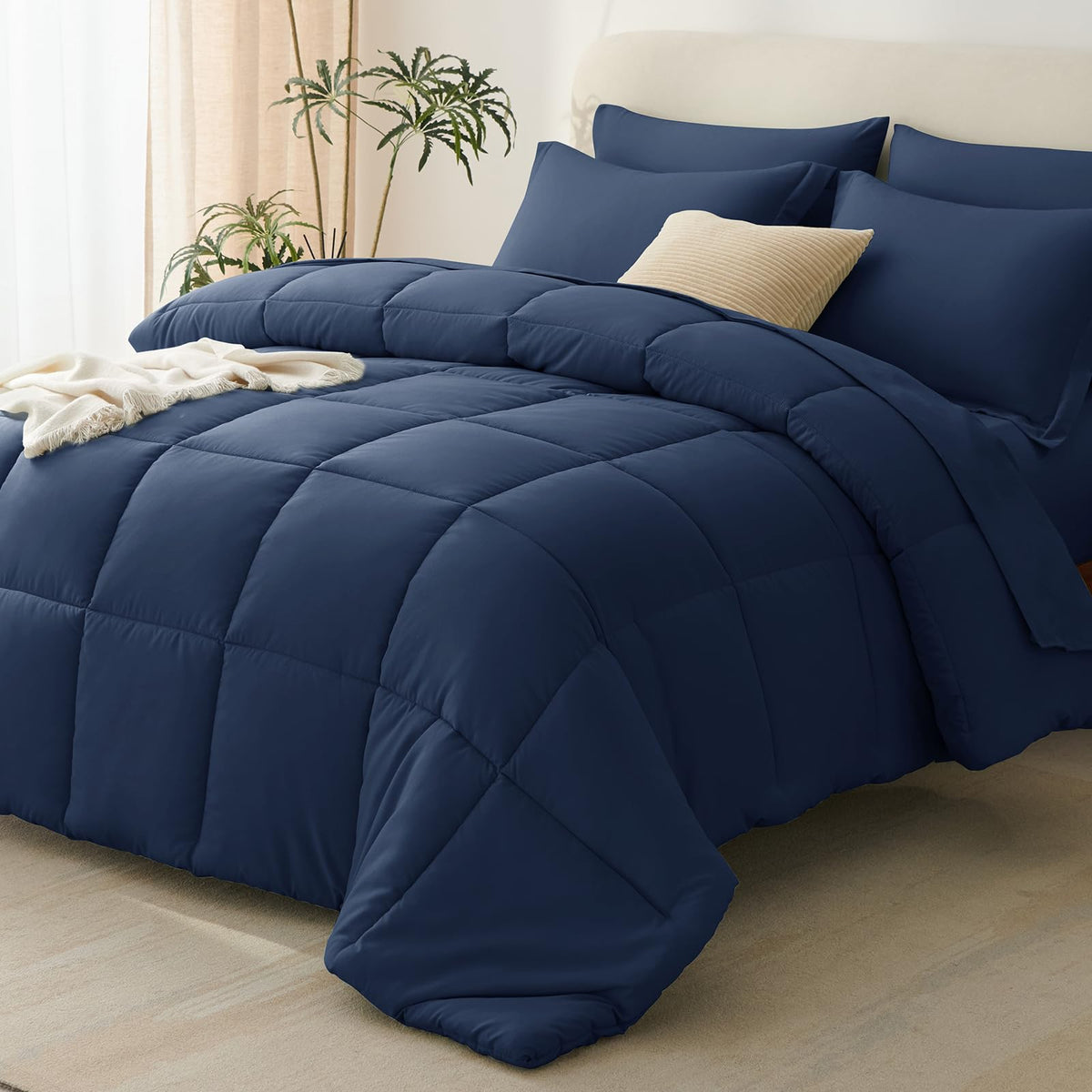 CozyLux full-size comforter set in navy blue packaging, ready for gifting.
